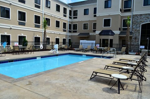 Unwind poolside on spacious loungers, soaking up the sun in a tranquil atmosphere.