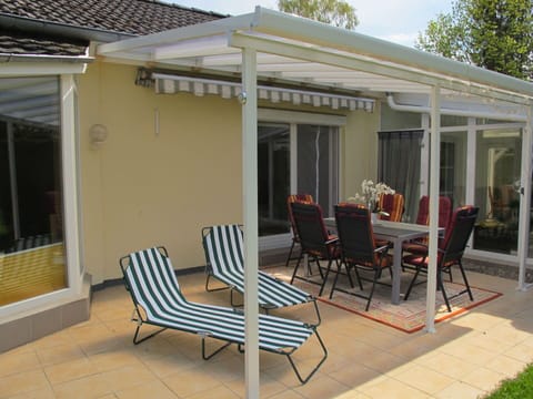 Furniture, Property, Chair, Building, Shade, Outdoor Furniture, Outdoor Table, Door, Window, Wood