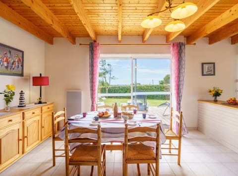 Furniture, Property, Table, Cabinetry, Chair, Lighting, Interior Design, Wood, Houseplant, Yellow