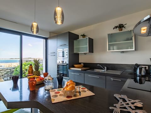 Property, Cabinetry, Furniture, Countertop, Table, Interior Design, Sink, Kitchen, Orange, Wood