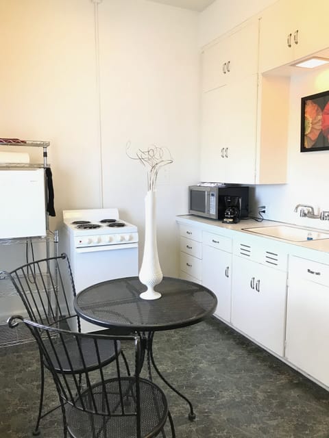 Kitchen, complete with stove, refrigerator and microwave.