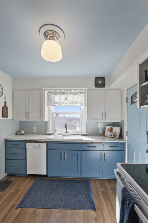 The kitchen window overlooks the back yard. 