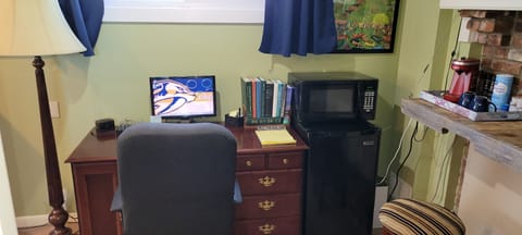 Desk with extra charger to keep the power up on your gadgets.