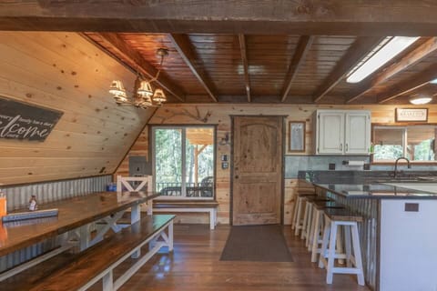  There is plenty of seating around the table or at the peninsula in the kitchen