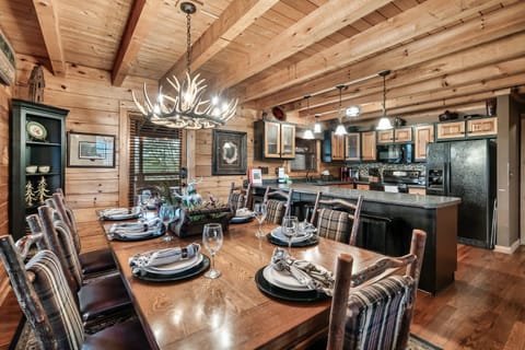 Door leads to BBQ, screened porch for added dining options, and hot tub