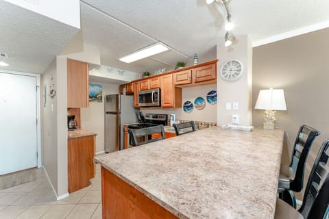 Our kitchenette has full-size appliances and seating for 4. Whether you're entertaining or enjoying a night in playing board games, you're going to love taking your vacation at South Padre Island!