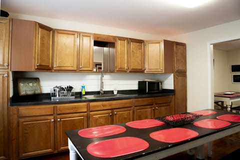 Additional dining room with another farm table, sink and counter for serving!
