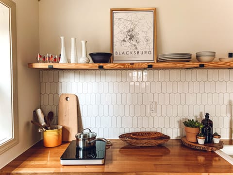 Kitchen with a cooktop, microwave, coffee pot, nespresso maker, toaster oven