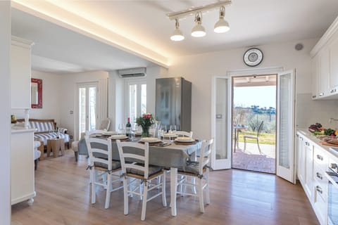 Dining and living area lead to covered patio.