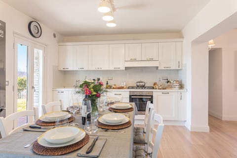 Table sits 6 people but can be opened on both ends to sit 10.