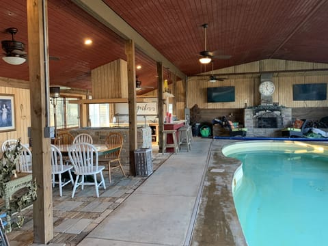 indoor pool with fireplace