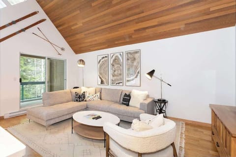 - Bright modern living room with vaulted wooden ceilings  
- Spacious mountain lodge with designer furniture and decor  
- Ideal space for cozy nights near Whistler Blackcomb ski area  
