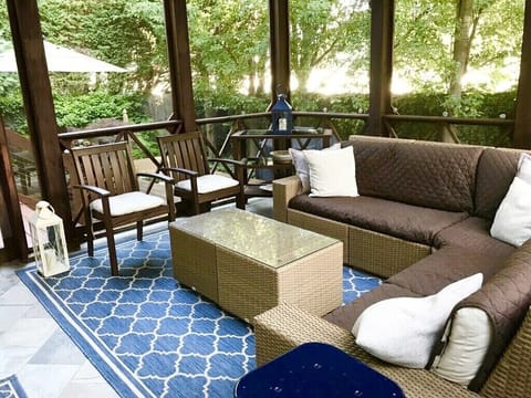 Outdoor patio with screened-in porch.  
