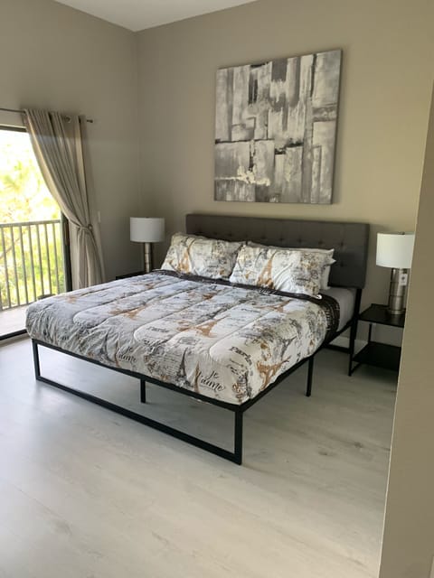 Bedroom 2- Guest bedroom with king sized bed and it’s own balcony and tv. 