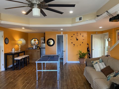 mini fridge, bar area, bar table and stools, full bathroom, ground entrance 