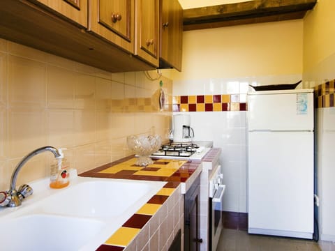 Room, Countertop, Kitchen, Property, Yellow, Cabinetry, Furniture, Interior Design, Building, House