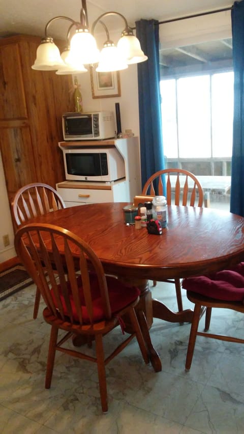 Kitchen/Dining area and sliding glass door to screened in porch.