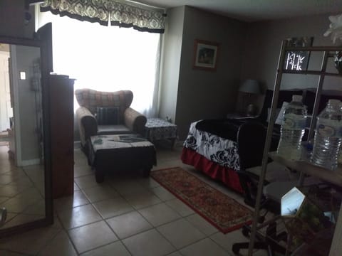 private room with ottoman bay window water stand