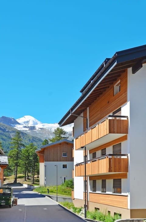 Building, Sky, Plant, Window, Mountain, Slope, House, Urban Design, Tree, Landscape