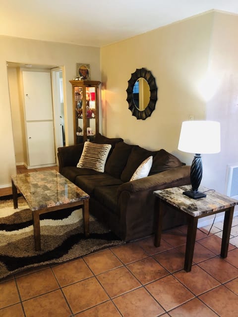 Professionally decorated living room with Italian tile floor. 