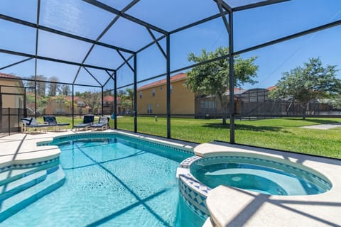 Private screened pool and spa in a secure gated resort, ideal for relaxing after visiting the parks