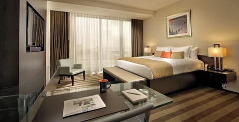 Unit with 1 King bed. Exact unit will be assigned upon arrival. Views, colors, and decor may vary.