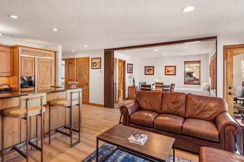 The den area doubles as dining room and an additional sleeping space with privacy provided by the accordion door when needed.