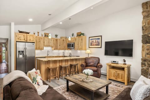 The open concept living and kitchen areas have been beautifully remodeled with natural hickory wood