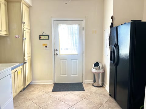 Laundry room with second refrigerator 