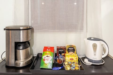 Coffee Station with Complimentary Essentials – Convenient setup for morning coffee or tea.