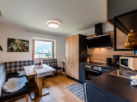 Table, Furniture, Countertop, Cabinetry, Wood, Lighting, Television, Home Appliance, Living Room, Kitchen Stove