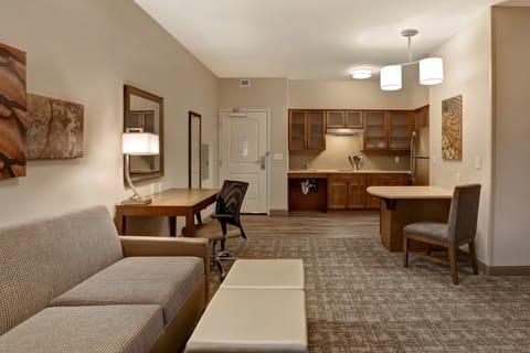 Living space with sofa, work desk, and tasteful decor.