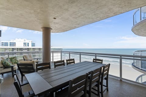 Spacious oceanfront balcony with dining for eight