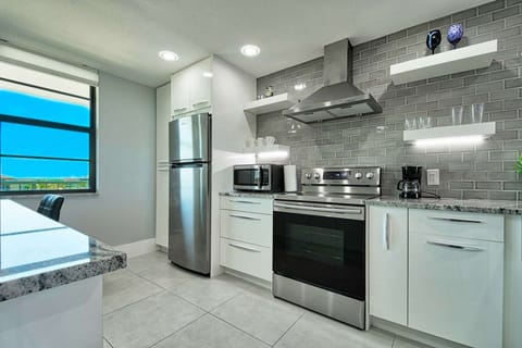 The gleaming kitchen is fully stocked and ready for you to whip up your favorite meal.