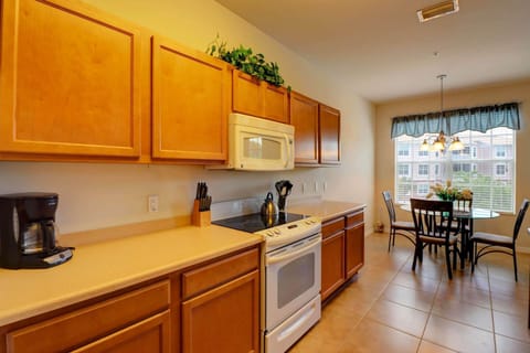 The kitchen features full size appliances and comes with cookware, serving ware, glasses, cutlery and many kitchen gadgets.