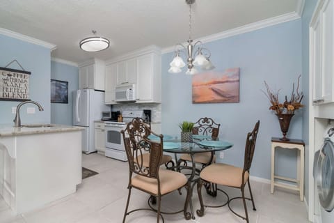 Dining table offers seating for 4, plus bar seating for two more.