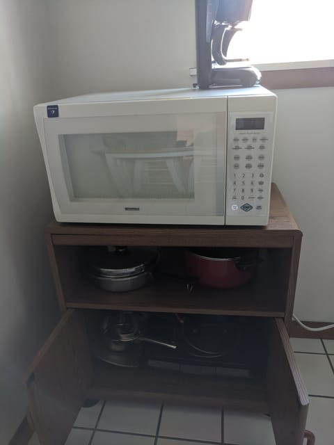 Pots and pans under microwave