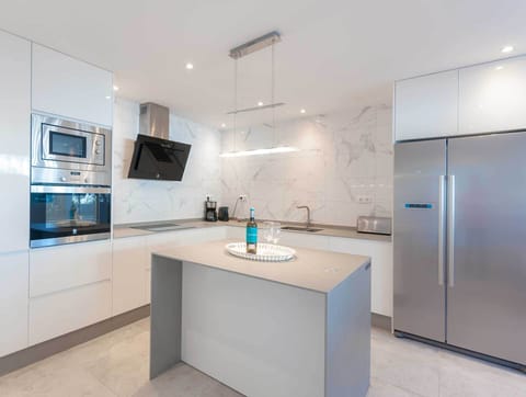 Sleek kitchen in beachfront apartment