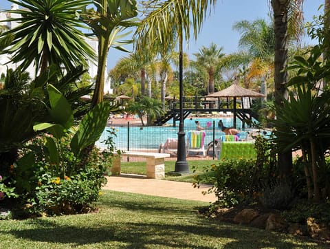 Landscaped gardens w 2 pools with shallow ends