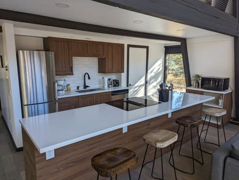 Remodeled fully stocked kitchen with breakfast bar
