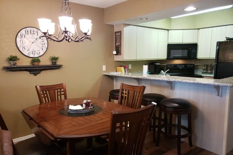 Dining Table for Four. Breakfast Bar Seating for Three.