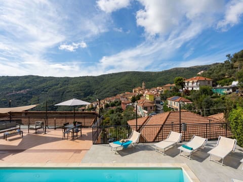 Cloud, Sky, Water, Building, Nature, Blue, Outdoor Furniture, Swimming Pool, Mountain, Tree