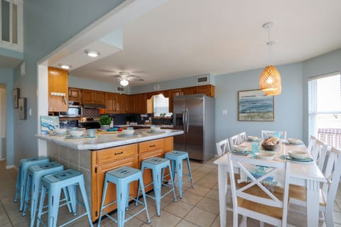 Large breakfast bar and dining area with seating for 14