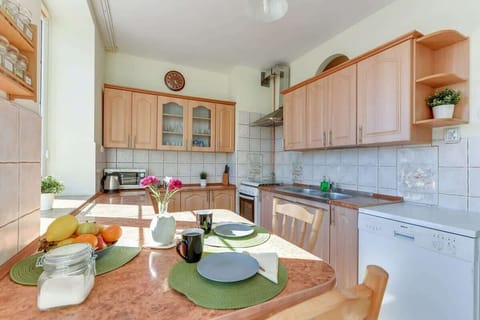 Separate kitchen with a dining table