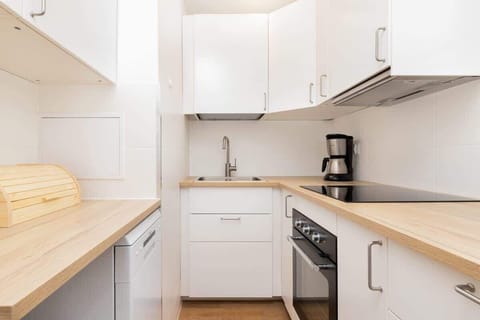 The kitchen featuring a spacious fridge for all your groceries.