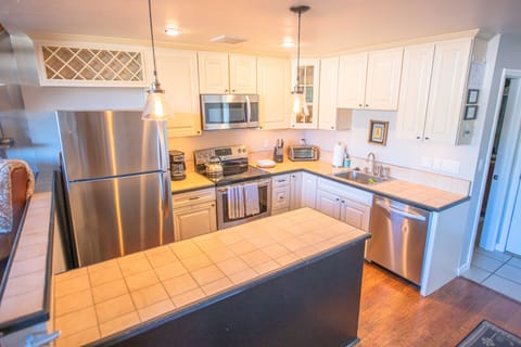 New stainless appliances, filtered water, and generously stocked kitchen.