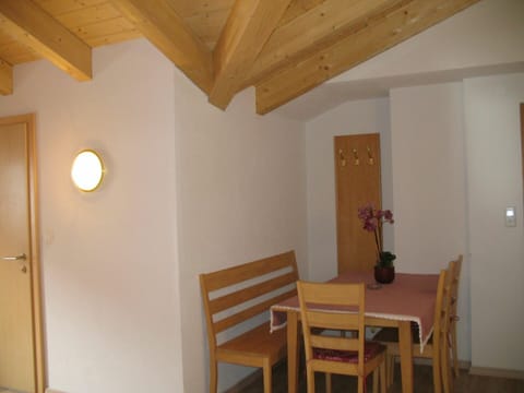 Property, Wood, Plant, Interior Design, Houseplant, Flooring, Wood Stain, Floor, Flowerpot, Chair