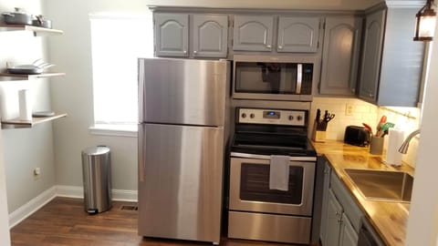 Fully stocked kitchen with coffee maker, toaster