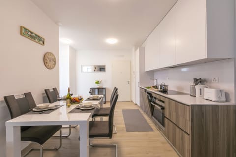 Dining room with full kitchen and dishwasher