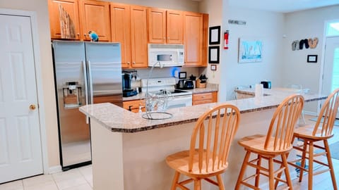 fully stocked kitchen with larger pantry